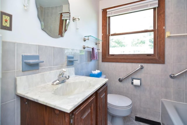 248 Levin Rd, Rockland, MA 02370 - bathroom with tile walls, vanity, a tub, and toilet