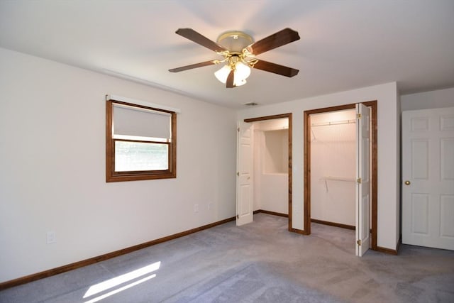 248 Levin Rd, Rockland, MA 02370 - unfurnished bedroom featuring two closets, carpet flooring, baseboards, and ceiling fan