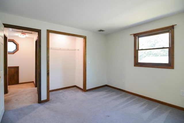 248 Levin Rd, Rockland, MA 02370 - unfurnished bedroom with light colored carpet, a closet, and baseboards