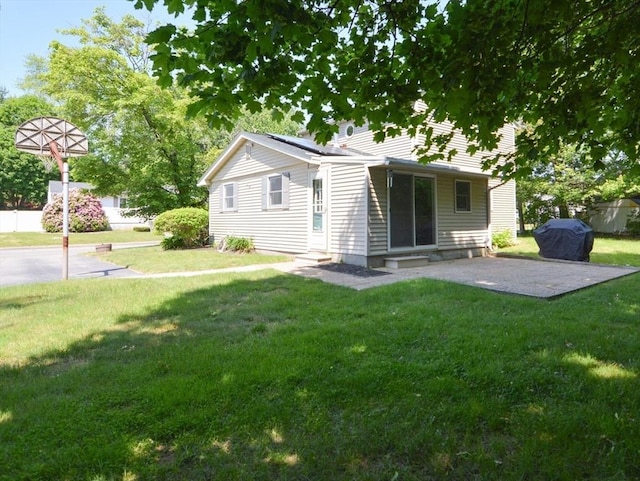 248 Levin Rd, Rockland, MA 02370 - rear view of property featuring entry steps, a patio area, a yard, and solar panels