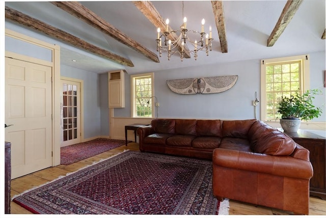 391 Brookfield Rd, Brimfield, MA 01010 - living area with wood finished floors, a chandelier, and healthy amount of natural light