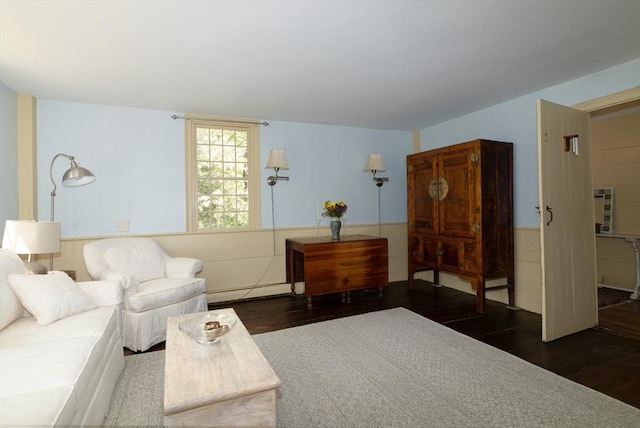 391 Brookfield Rd, Brimfield, MA 01010 - living area with wood finished floors, a wainscoted wall, and baseboard heating