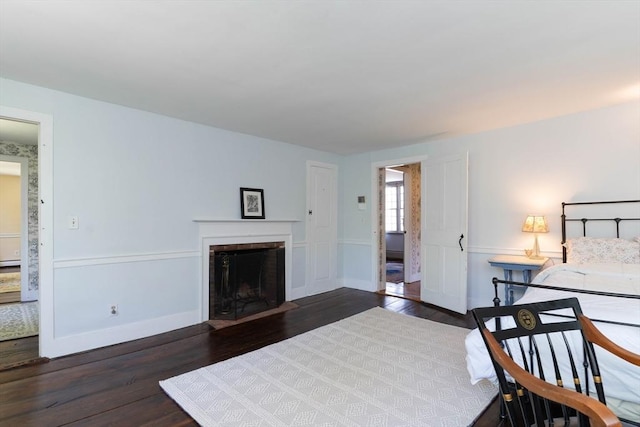 391 Brookfield Rd, Brimfield, MA 01010 - bedroom with wood finished floors, a fireplace, and baseboards