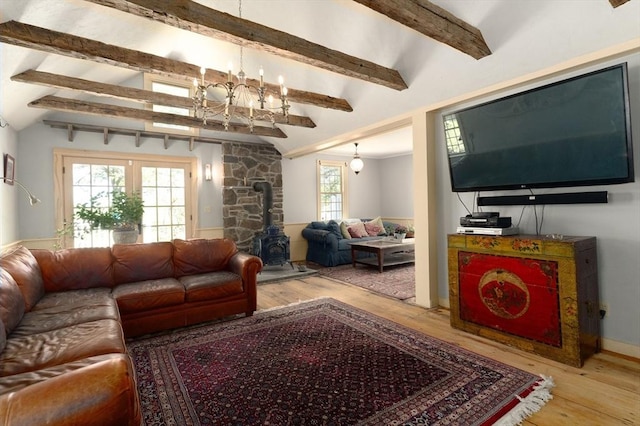 391 Brookfield Rd, Brimfield, MA 01010 - living area featuring wood-type flooring, a wood stove, and a chandelier