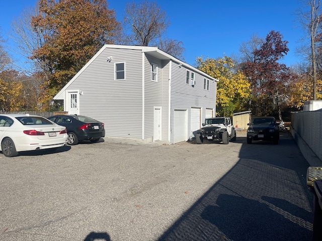 view of property exterior with a garage