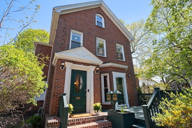 traditional-style house with brick siding