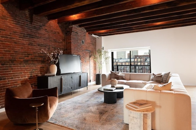 living room featuring beamed ceiling and light hardwood / wood-style flooring