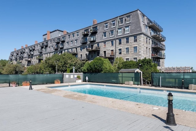 view of pool featuring a patio area