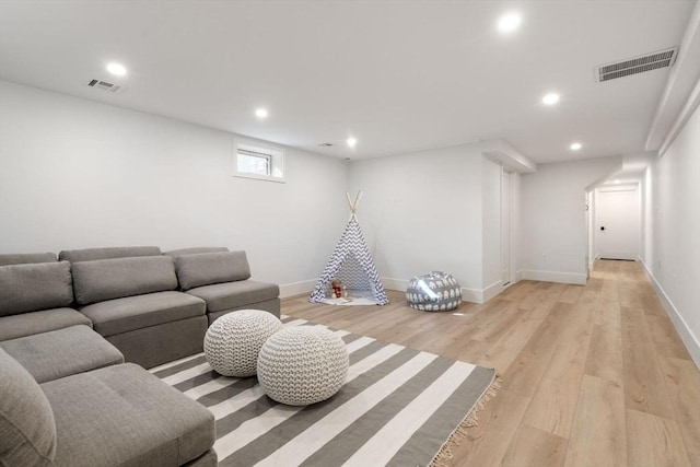137-139 Crafts St, Newton, MA 02460 - living room with recessed lighting, light wood-style floors, and baseboards