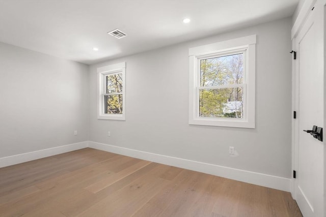 137-139 Crafts St, Newton, MA 02460 - spare room featuring healthy amount of natural light, baseboards, light wood-style floors, and recessed lighting