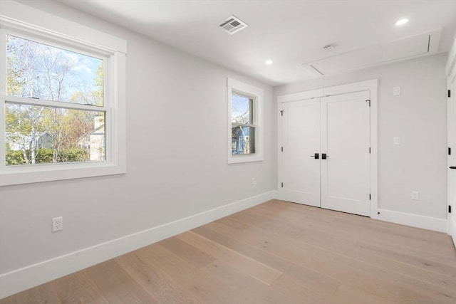 137-139 Crafts St, Newton, MA 02460 - unfurnished bedroom with attic access, baseboards, light wood finished floors, recessed lighting, and a closet