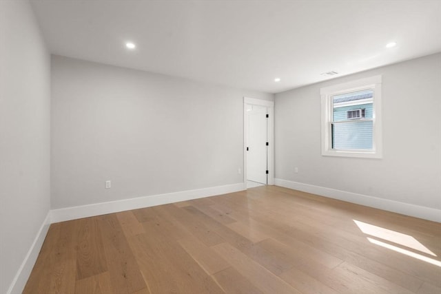 137-139 Crafts St, Newton, MA 02460 - spare room featuring light wood finished floors, baseboards, and recessed lighting