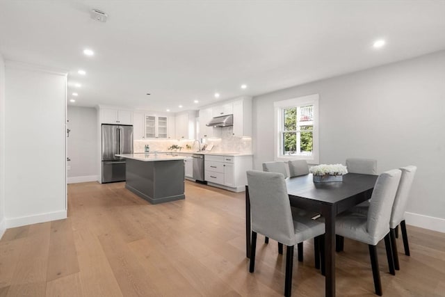 137-139 Crafts St, Newton, MA 02460 - dining space with recessed lighting, baseboards, and light wood finished floors