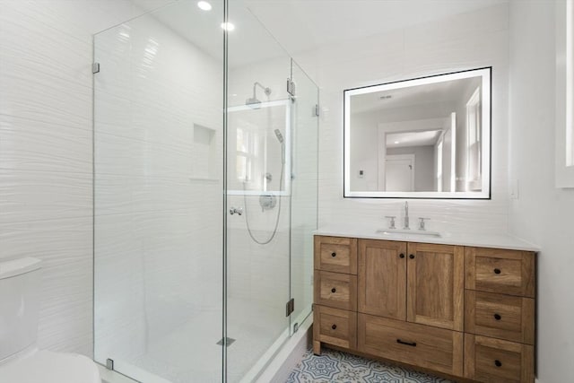 137-139 Crafts St, Newton, MA 02460 - full bathroom featuring toilet, vanity, a stall shower, and tile walls