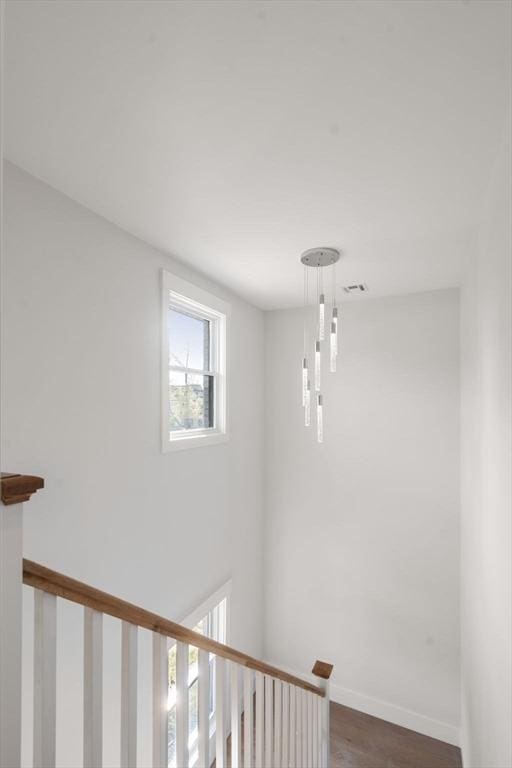 137-139 Crafts St, Newton, MA 02460 - stairs featuring wood finished floors and baseboards