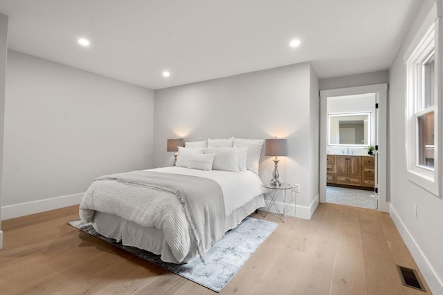 137-139 Crafts St, Newton, MA 02460 - bedroom with baseboards, light wood-type flooring, and recessed lighting
