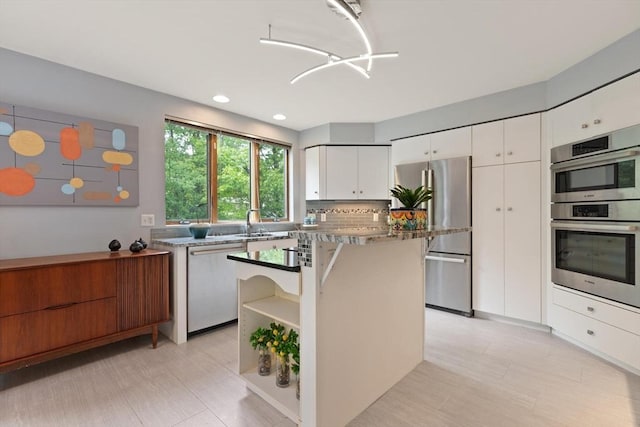 887 High Rock Rd, Fitchburg, MA 01420 - kitchen featuring stainless steel appliances, white cabinets, open shelves, a kitchen island, and backsplash