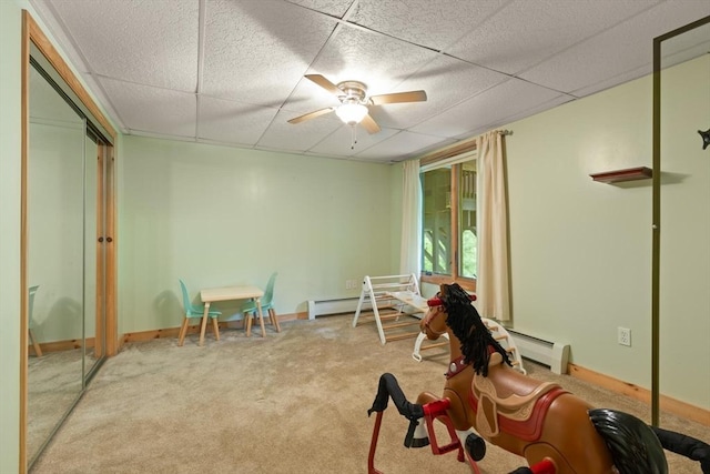 887 High Rock Rd, Fitchburg, MA 01420 - recreation room featuring a paneled ceiling, carpet floors, a baseboard radiator, a ceiling fan, and baseboards