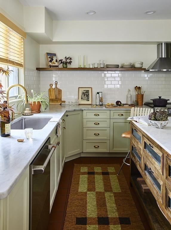 26 Moultrie St Unit 26, Boston, MA 02124 - kitchen with wall chimney exhaust hood, open shelves, a sink, stainless steel dishwasher, and backsplash