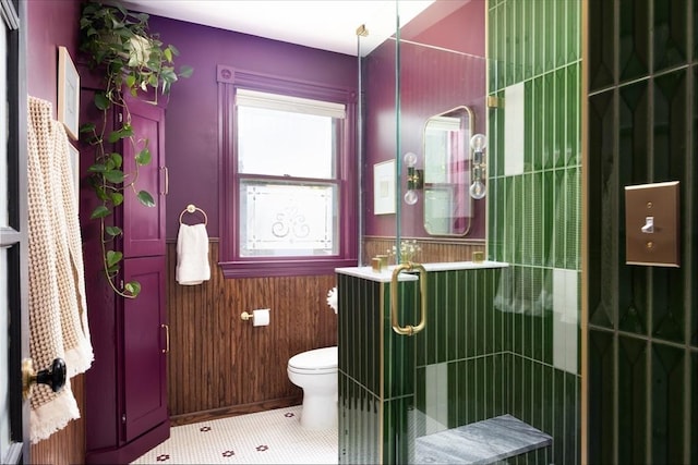 26 Moultrie St Unit 26, Boston, MA 02124 - bathroom featuring toilet, a tile shower, wainscoting, and tile patterned flooring