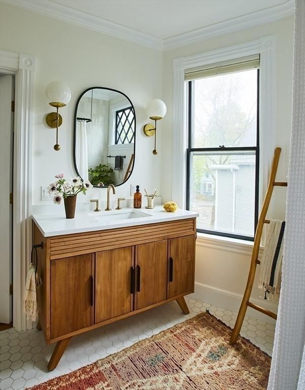 26 Moultrie St Unit 26, Boston, MA 02124 - bathroom with crown molding and vanity