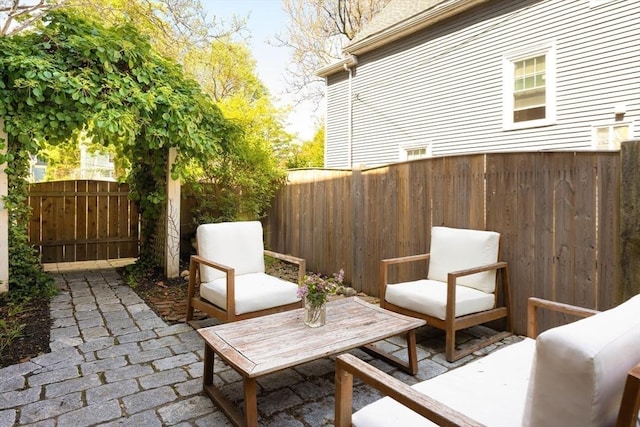 26 Moultrie St Unit 26, Boston, MA 02124 - view of patio with a fenced backyard and an outdoor hangout area