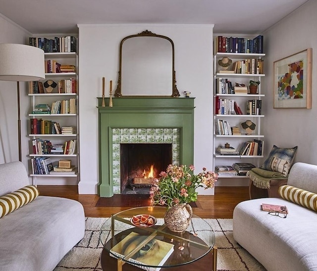 26 Moultrie St Unit 26, Boston, MA 02124 - sitting room with wood finished floors, a tile fireplace, and crown molding