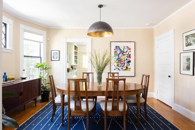 26 Moultrie St Unit 26, Boston, MA 02124 - dining room with wood finished floors, baseboards, and ornamental molding