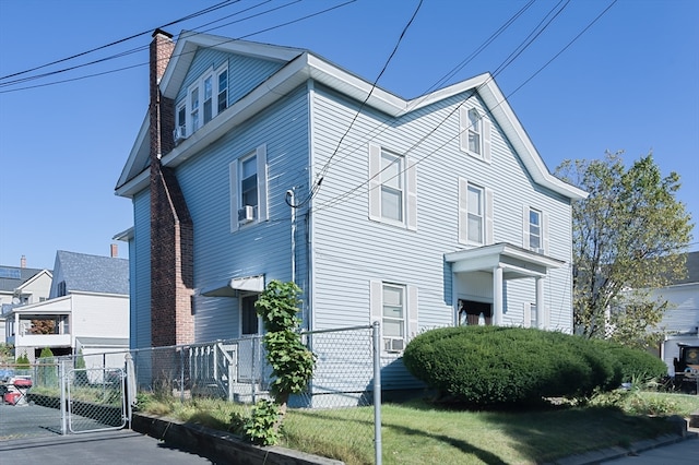 view of side of home featuring a lawn