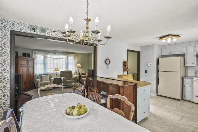 dining room featuring a notable chandelier