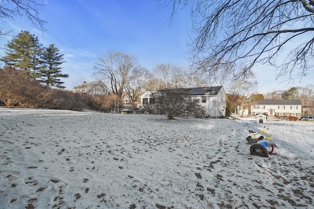 view of yard layered in snow