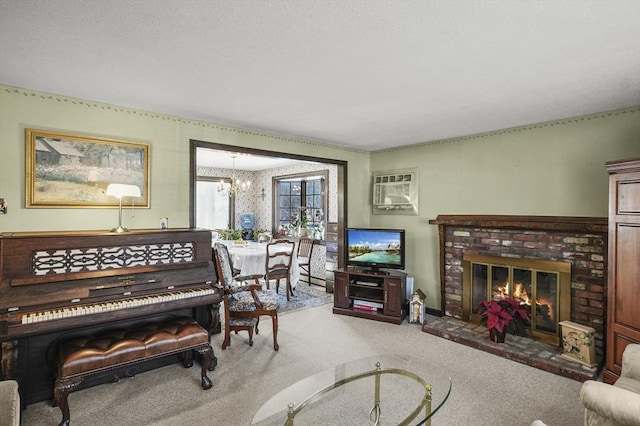 interior space featuring a brick fireplace, an inviting chandelier, carpet floors, and a wall mounted air conditioner