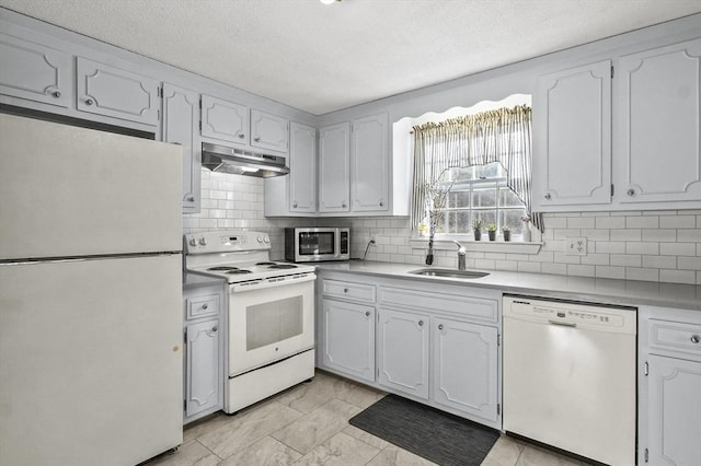 kitchen featuring stainless steel appliances, white cabinets, and sink