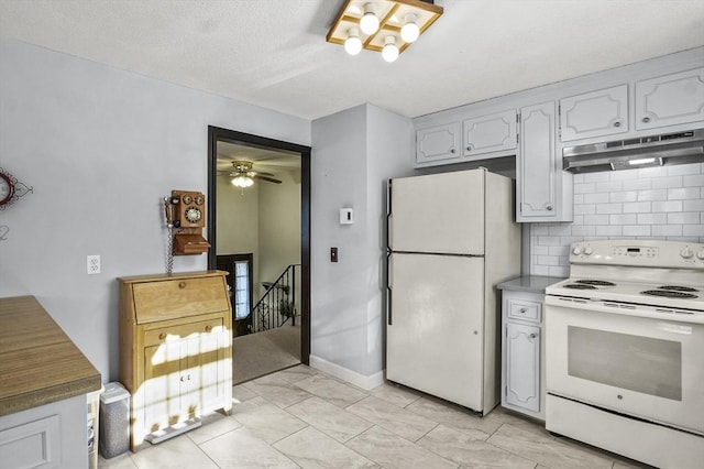 kitchen featuring ceiling fan, backsplash, white appliances, and white cabinets