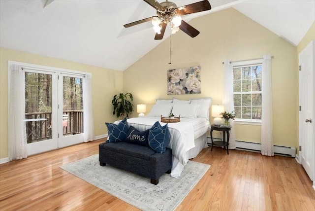 bedroom with ceiling fan, baseboard heating, wood finished floors, high vaulted ceiling, and access to outside