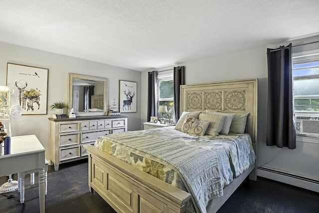 32 Nancy Rd, Milford, MA 01757 - bedroom featuring baseboard heating, dark wood-style flooring, and a textured ceiling