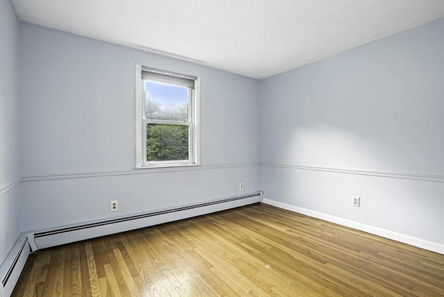 32 Nancy Rd, Milford, MA 01757 - spare room with a baseboard heating unit and wood finished floors