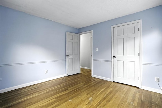 32 Nancy Rd, Milford, MA 01757 - unfurnished bedroom featuring wood finished floors