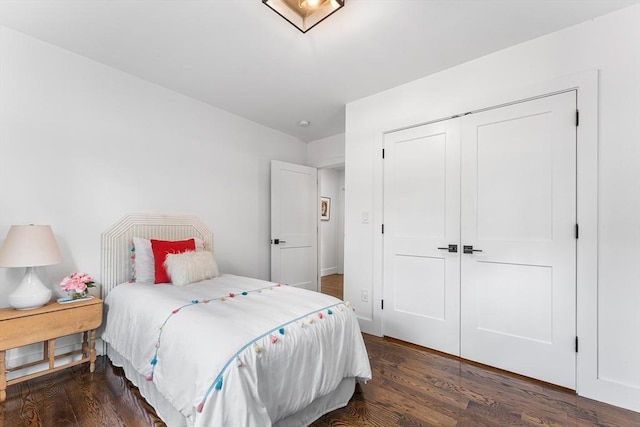 bedroom featuring wood finished floors and a closet