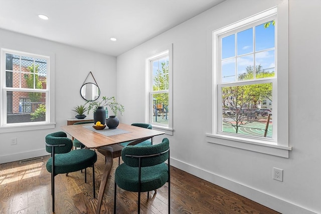 dining room featuring baseboards, plenty of natural light, dark wood-style floors, and recessed lighting