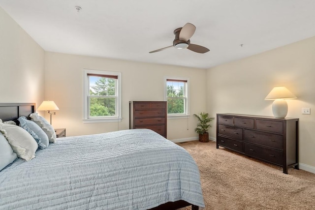 32 Old Framingham Rd Unit 34, Sudbury, MA 01776 - bedroom with multiple windows, light carpet, and ceiling fan