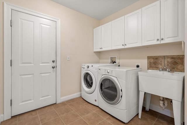 32 Old Framingham Rd Unit 34, Sudbury, MA 01776 - laundry area featuring cabinet space, independent washer and dryer, and light tile patterned floors