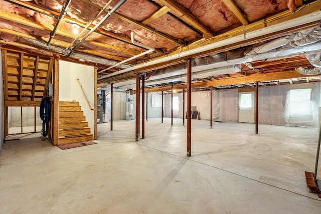 32 Old Framingham Rd Unit 34, Sudbury, MA 01776 - below grade area featuring gas water heater and stairway