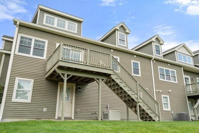 32 Old Framingham Rd Unit 34, Sudbury, MA 01776 - rear view of house featuring stairway, a deck, and a yard