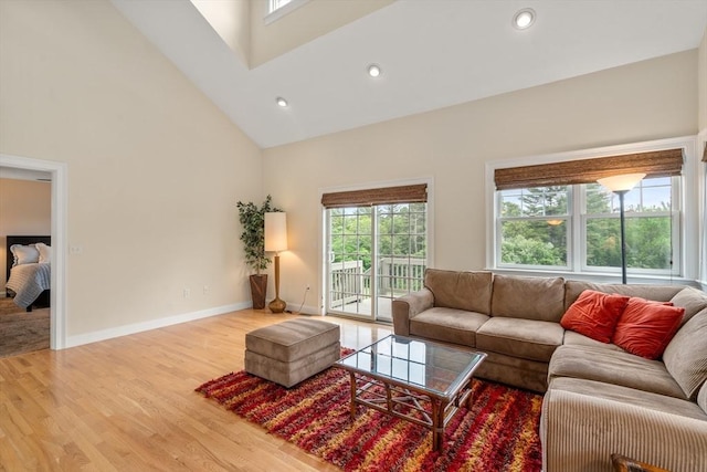 32 Old Framingham Rd Unit 34, Sudbury, MA 01776 - living room featuring healthy amount of natural light, high vaulted ceiling, wood finished floors, and recessed lighting