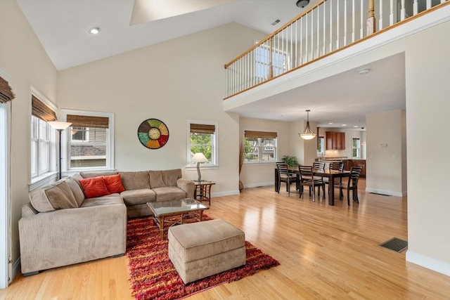 32 Old Framingham Rd Unit 34, Sudbury, MA 01776 - living room with high vaulted ceiling, light wood-type flooring, and recessed lighting