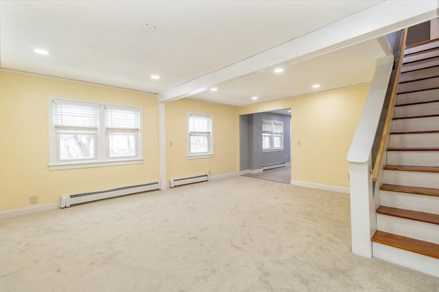 basement featuring light carpet and a baseboard radiator