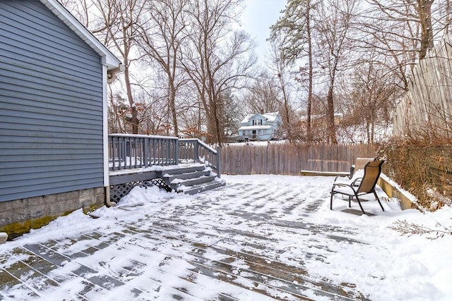 view of snow covered deck