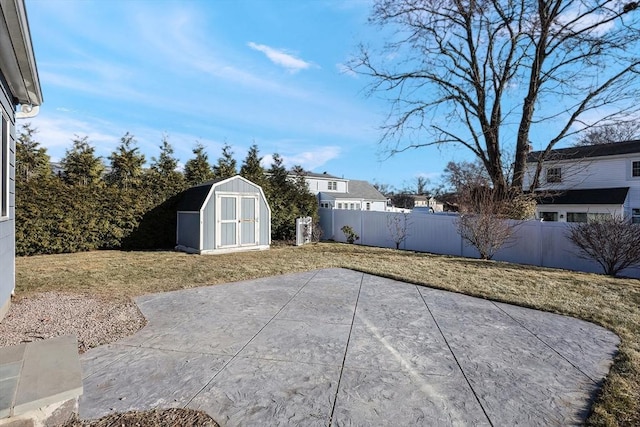 view of patio featuring a storage unit