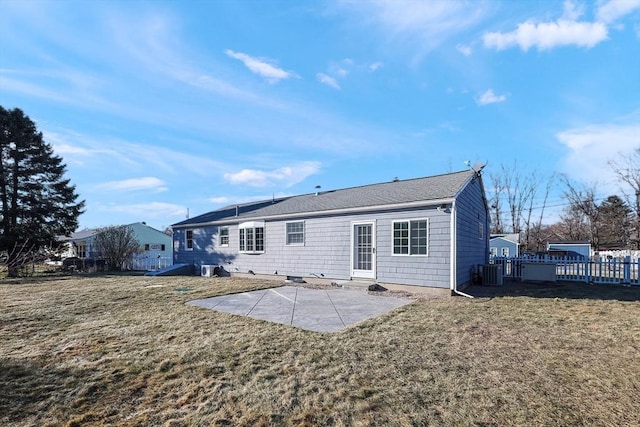 back of house featuring a patio, central AC unit, and a lawn